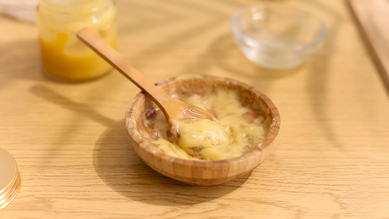 A Wooden Bowl Containing a Diy Natural Hair Mask Mixture